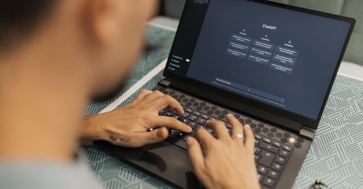 Team reviewing software on a laptop